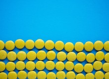 The Ukranian Flag Made Of Yellow Candy On Blue Solid Background.