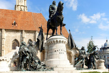 The Church Of Saint Michael Is A Gothic-style Roman Catholic Cathedral In Cluj, Second Largest Church In Transylvania, Romania, Completed In 1442-1447.Statue Of King Mathias (Matyas, Matei, Corvinus)