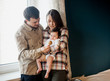 © Yuliia Blazhuk - Lovely family of young parents and baby together at home