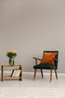 © Photographee.eu - Green retro armchair in grey living room interior with wooden furniture