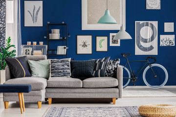 Wall Mural - Blue living room with inspiring poster on the wall and grey corner sofa