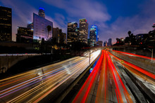 JANUARY 20, 2019, LOS ANGELES, CA, USA - California 110 South Leads To Downtown Los Angeles With Streaked Car Lights At Sunset