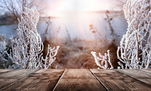 Winter Background. Winter Snow Landscape With Wooden Table In Front. Winter Sun, Ray, Glare. Empty Natural Scene With A Wooden Table.