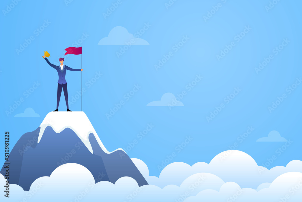 Successful businessman holding a flag and trophy on top of mountain ...