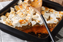 Traditional Sweet Potato Dessert Casserole With Pecans And Marshmallows Close-up In A Baking Dish. Horizontal
