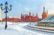 Moscow in winter, Russia. View of the snowy Manezhnaya Square, tourist attraction of the city. Panorama of the Moscow center during snowfall.