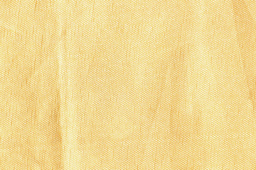 Light yellow silk fabric. Textile Background Texture. Expensive material. High resolution. Bruises are visible on the surface of the fabric.