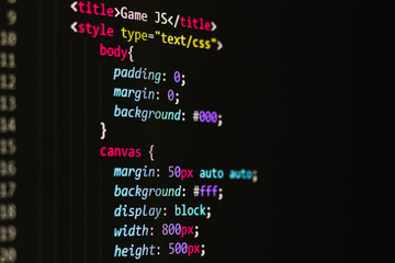 Wall Mural - html code on a black background on the monitor