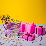 Fototapeta Mapy - Gift shopping, shopping cart is full of gift boxes. New year's shopping concept