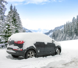 Poster - Winter black car cover of snow and winter landscape of forest and mountains. 