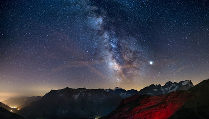 Wall Mural - the milky way arch starry sky on the alps, massif des ecrins, briancon serre chevalier ski resort, f