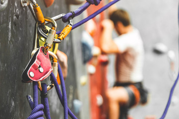 Wall Mural - Close-up detail of rock climber wearing safety harness and climbing equipment outdoor. climbing carabiner insurance.