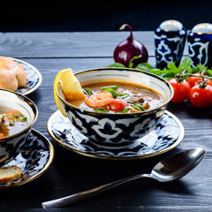 Canvas Print - homemade shurpa soup on a black table