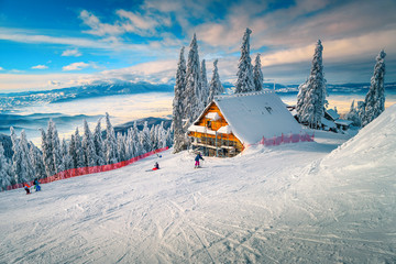 Wall Mural - Wonderful ski resort with skiers, Poiana Brasov, Carpathians, Transylvania, Romania