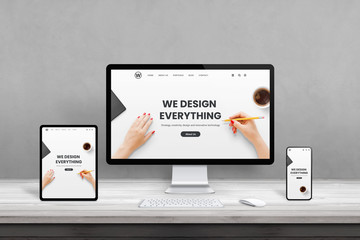 Poster - Web design studio with multiple devices on office desk. Concept of responsive, flat web page design. Modern devices with thin edges on wooden desk
