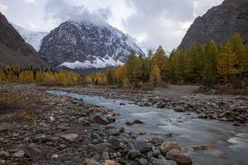 Autumn landscape with Aktru river and peak Karatash. Altai. Russia