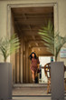 © xpabli - Young woman walking happily on the streets of Bucharest