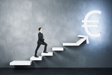 Canvas Print - Businessman climbs stairs to a glowing euro sign