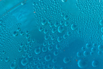 Wall Mural - Blue water drops background close up