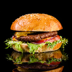 Sticker - fast food juicy burger on a black background