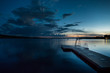 Wood jetty in lake at evening for bathing and swimming