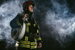 © alfa27 - caucasian modern hero fireman in uniform don't afraid of danger, looking for people to save, using ropes, hammers and other equipment need for protection