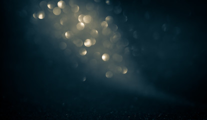 Wall Mural - blue abstract glitter bokeh on black background