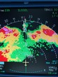 Airliner on board weather radar displaying weather returns landing during a storm