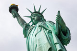 Fototapeta Miasta - Looking Up at the Statue of Liberty in New York