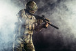 © alfa27 - brave and strong soldier in military uniform holding rifle in hands. military service concept