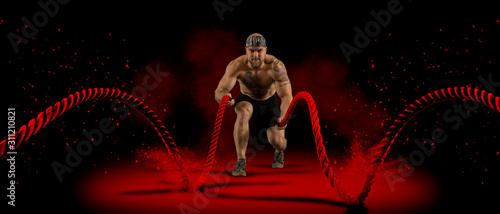 Fotomural Man working out with battle ropes
