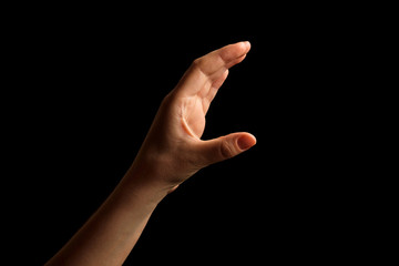 Hand Showing Sign of C Alphabet in American Sign Language (ASL), isolated on black background. Sign language