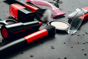 Canvas Print - A set of cosmetics on a dark stone background. The concept of doing makeup, caring for the appearance of women. Applying brushes, eye shadows, powder.