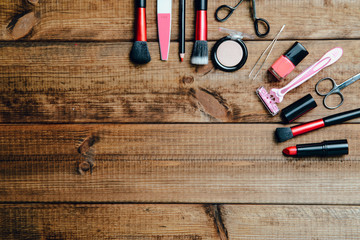 Canvas Print - A set of cosmetics on a wooden table. The concept of doing makeup, caring for the appearance of women. Applying brushes, eye shadows, powder.