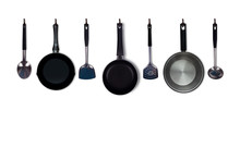 Set Of Kitchen Utensils Hanging On White Wall Background.stainless Steel Kitchenware,spatula,ladle,pan,pot