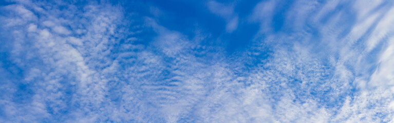 Wall Mural - Panorama blue sky background with tiny clouds