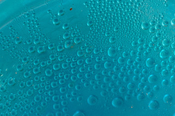 Wall Mural - Blue water drops background close up