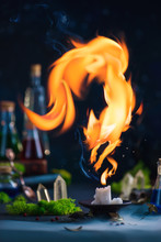 Fire Fox Figure Above Candle Flame, Magical Still Life With Copy Space