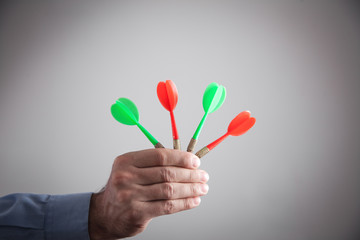 Wall Mural - Male hand holding darts. Target, Business