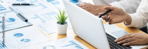 Cuadros en Lienzo Two business teamwork calculating a valuation in workplace.