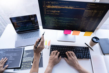 Pensive Programmer Working On On Desktop Pc Programming Code Technologies Or Website Design At Office Software Development Company