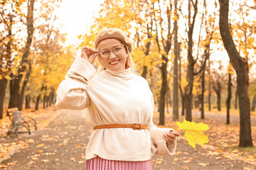 Sticker - Beautiful mature woman in autumn park