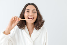 Beautiful Young Woman With Toothbrush On Light Background