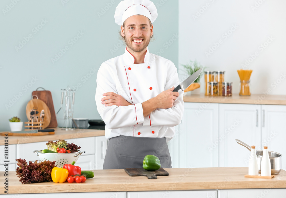 Portrait of male chef in kitchen