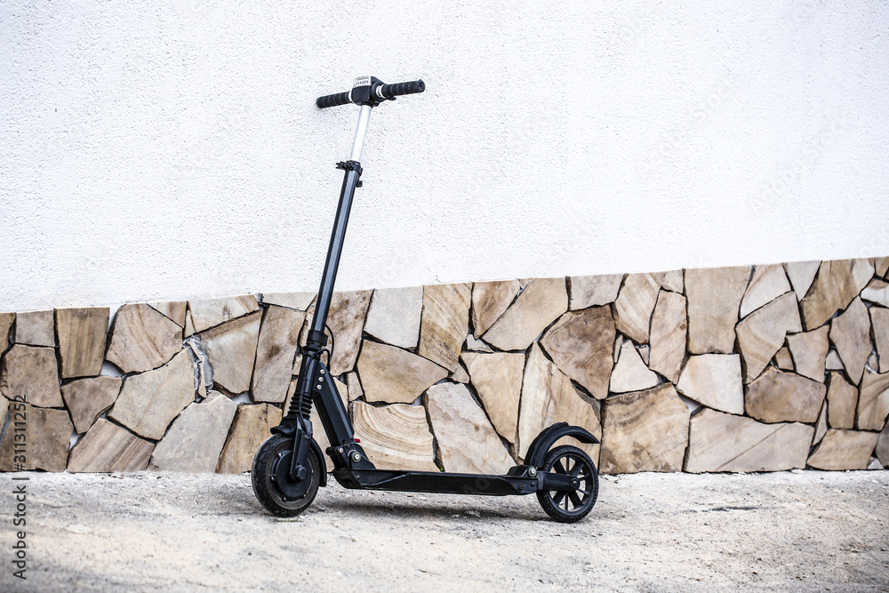Modern electric kick scooter outdoors