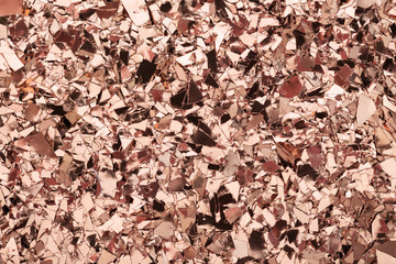 Wall Mural - pink gold glitter foil confetti background. festive, party or holiday backdrop. flat-lay, close-up.