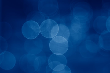 Fototapete - abstract  pale blurred circular bokeh lights background toned in trendy Classic Blue color of the Year 2020