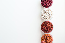 Different Seed Beans In Round Plates Are Arranged In A Row.