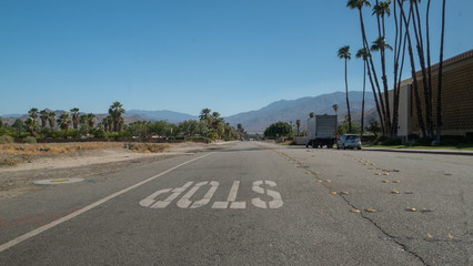 Wall Mural - Stop sign on a road in the desert, california