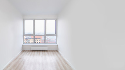 White room with window in a high-rise house